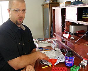 Portrait of Travis Peacock reloading writer